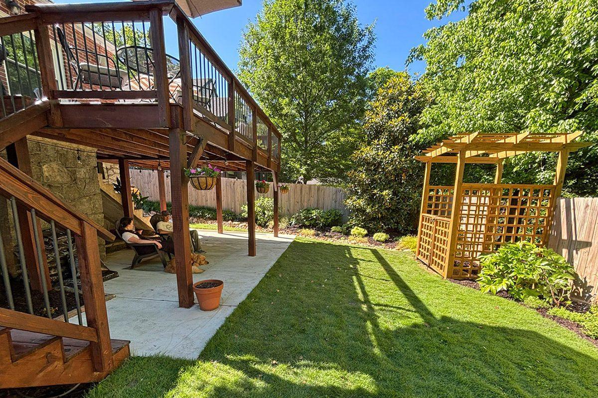 Permitted deck redesign and river rock drainage bed in Decatur