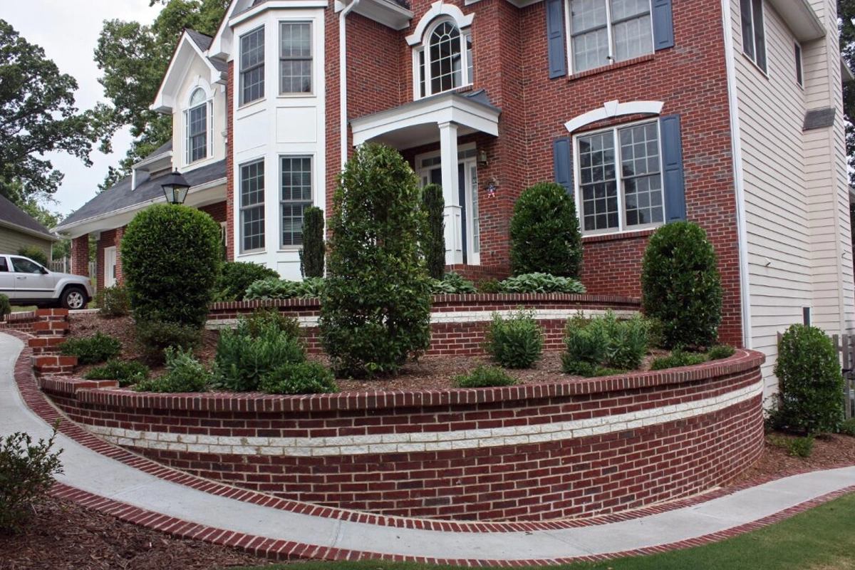 Permitted deck redesign and river rock drainage bed in Decatur